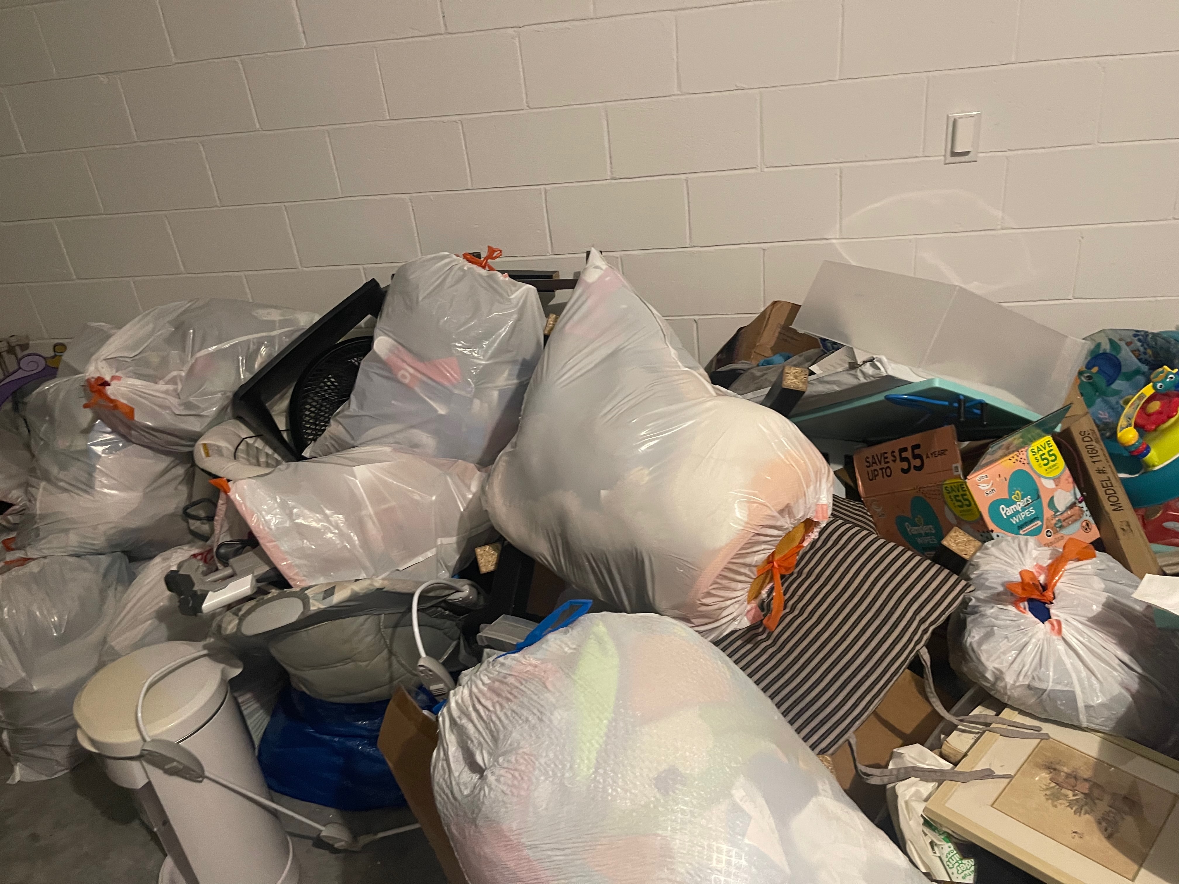 Bagged trash and household items collected from a residence